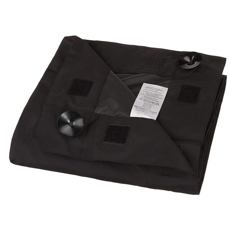 The blackout blind folded flat with its suction cups