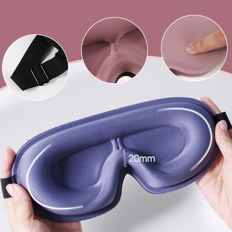 Purple AVXT Blackout Eye Mask held open to show its deep eye cups