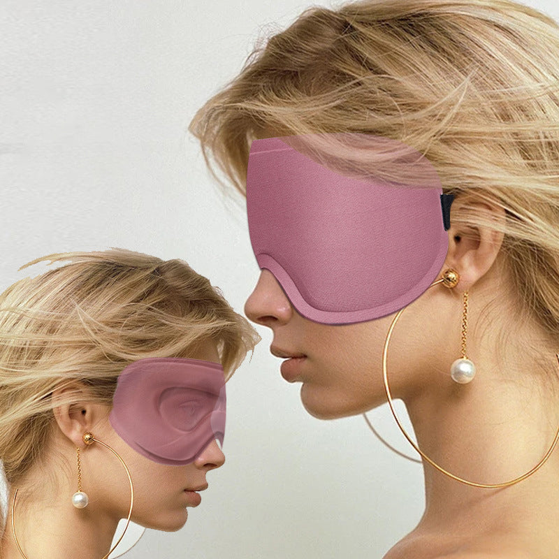 Two people wearing the pink AVXT Blackout Eye Mask, seen from the side